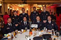firefighters sitting at table during award breakfast 
