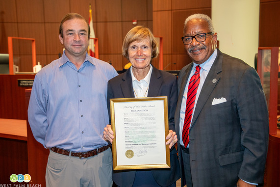 Mayor James presents proclamation Celebrating 100 Years of Rosarian Academy, group photos with two others 
