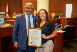 Amelia Sherfield accepts the West Palm Beach Week Without Driving proclamation from Mayor Keith A. James.
