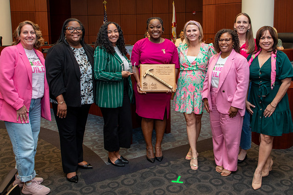 HCD Award to Jade A. Greene and Lucy Joseph, group photo with 8 people 