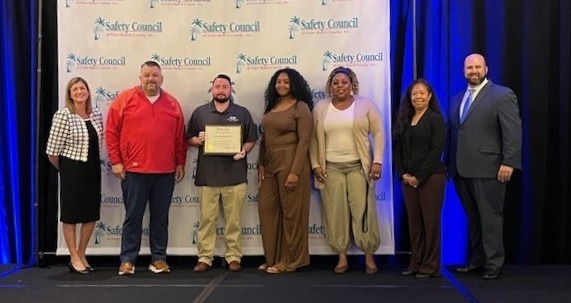 group photo on stage - West Palm Beach Recognized for Excellence in Safety