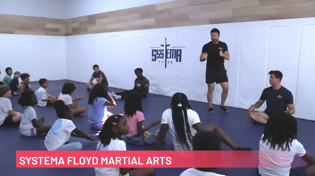 Kids listen to an instructor speak at a Systema Floyd Martial Arts in West Palm Beach