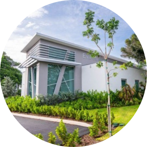 Eva Mack Center Photo, Outside of Grey and white building 