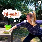 Image of young woman energetically karate-chopping bucket of water to help control mosquito breeding