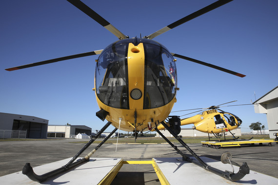 Mosquito Control yellow helicopters outside their hangar