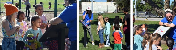 kids participate in Library StoryWalk activity at outdoor park