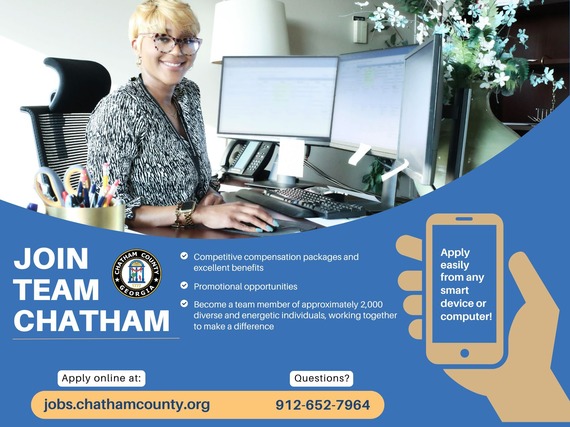 Young female executive at work in nicely appointed office