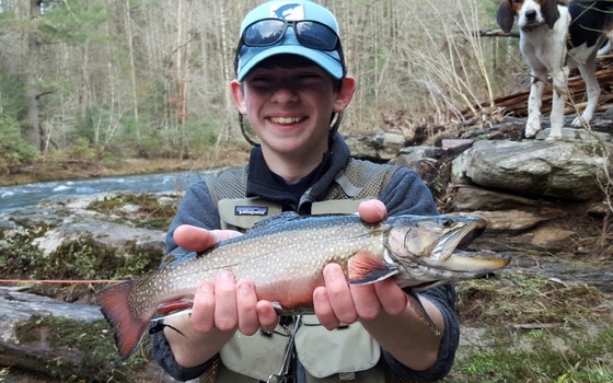 Young angler with trout