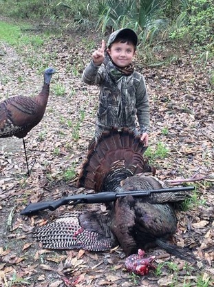 Young hunter with turkey
