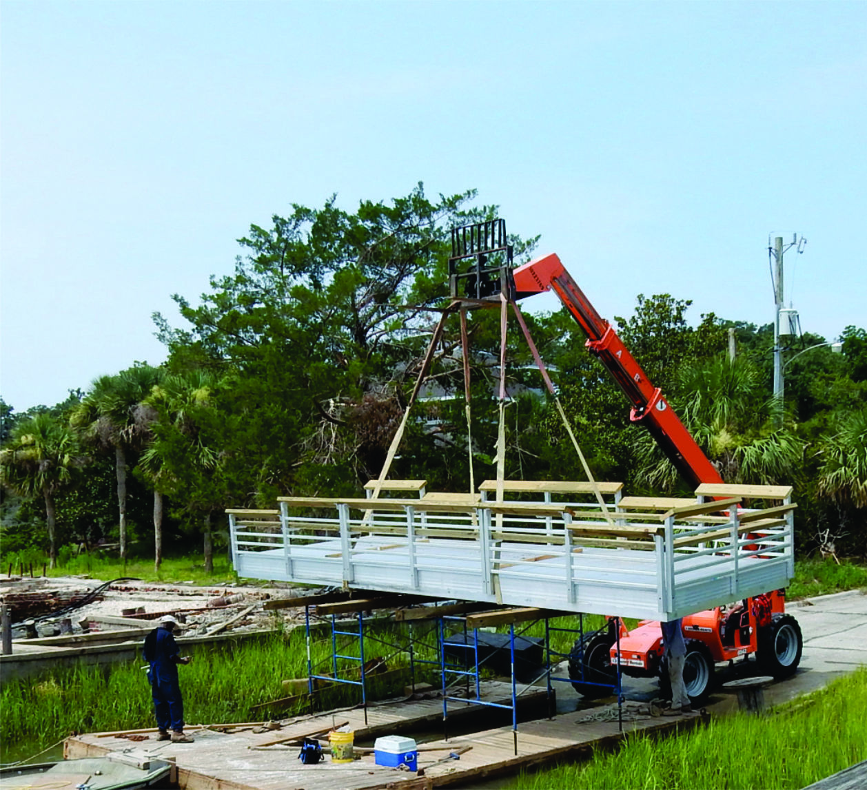 Contractors install the final section of floating dock for the public boat ramp at Sunbury.