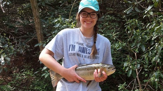 Teen with rainbow trout