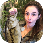 Woman holding largemouth bass