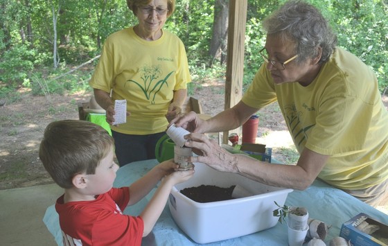 Planting plants with the Garden Club of Georgia