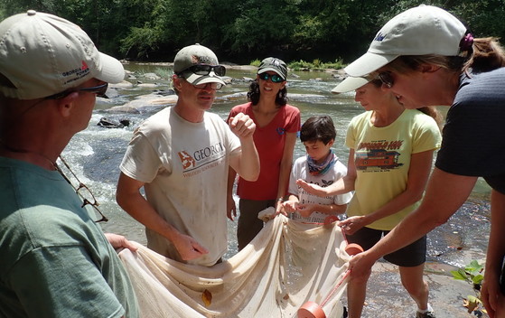 Brett Albanese and staff explain fish sampling techniques to a group (Paula Marcinek/DNR)