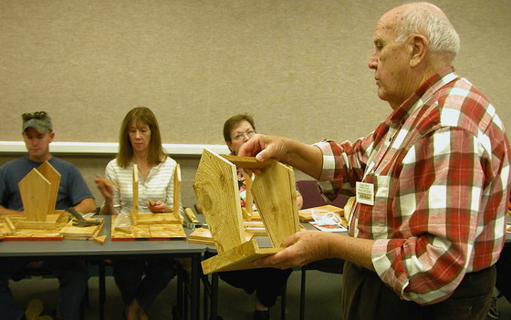 Bill Baker leads a Charlie Elliott class on building bird feeders in 2007 (Linda May/DNR)