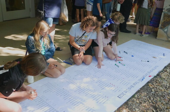 A YBC team leader and members mark species the youth saw or heard on a checklist at Charlie Elliott Wildlife Center Saturday. (Ethan Hatchett/DNR)