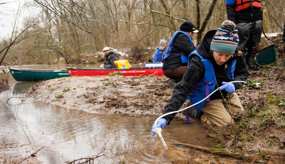 DNR staff taking water samples from a stream