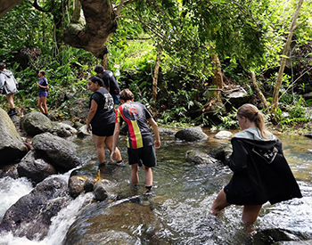 Students cross stream