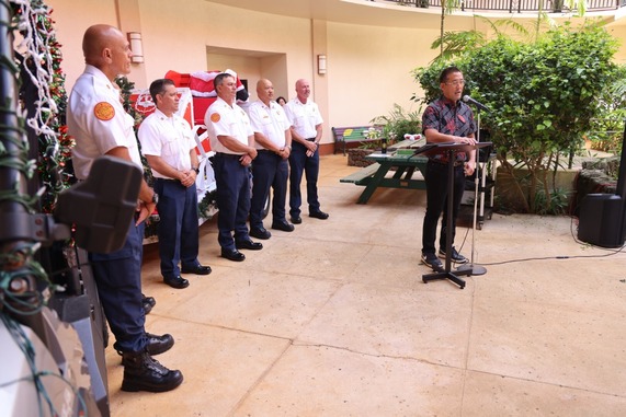 Mayor Derek Kawakami (right) speaks to a crowd gathered at the KFD and OSB promotional ceremony on Friday, Dec. 13, at the Līhu‘e Civic Center. 