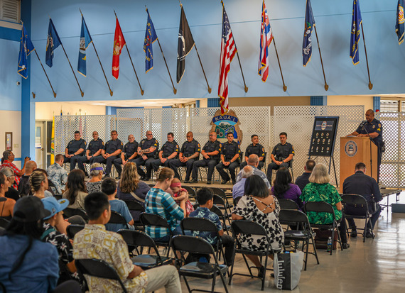 Photo of officers lined up on stage.