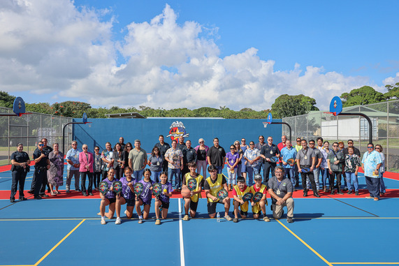 Community leaders, partners, and supporters gather to celebrate the grand opening of the new K-PAL multipurpose court in Līhu‘e.