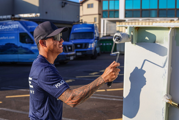 Officer cleaning graffiti