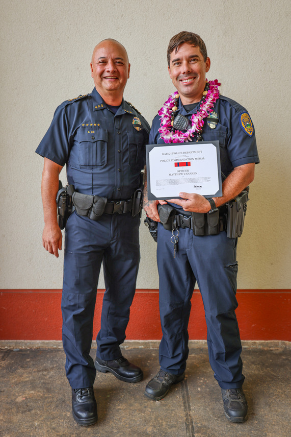 Officer Matthew VanAken is presented the Police Commendation Medal by Chief Kalani Ke