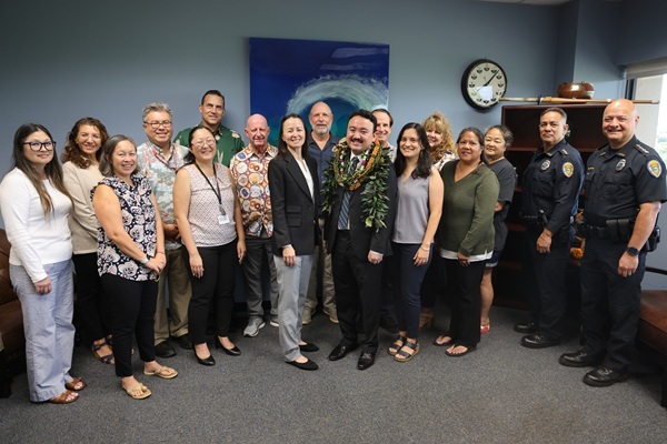 County of Kaua'i officials gather for the swearing in ceremony of Tyler Saito.