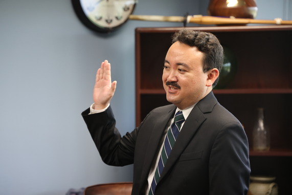 Tyler Saito sworn in as County Attorney.