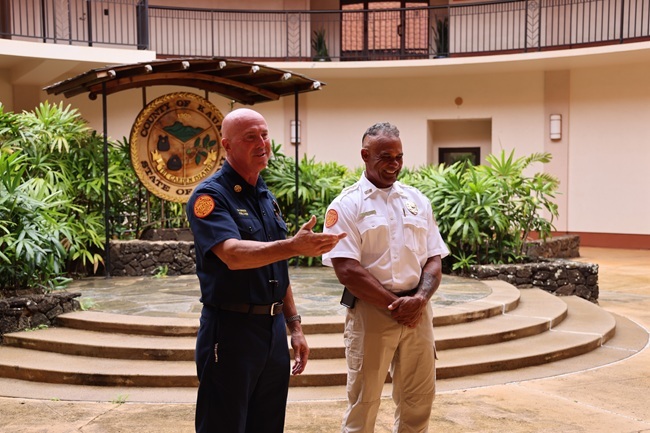 Kaua‘i Fire Department Chief Michael Gibson (left) and Ocean Safety Bureau Chief Kalani Vierra (right) address the crowd.