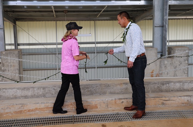 Mayor Derek S.K. Kawakami (right) and Public Works Solid Waste Division Chief Allison Fraley (left) untie the lei at the blessing ceremony. ###