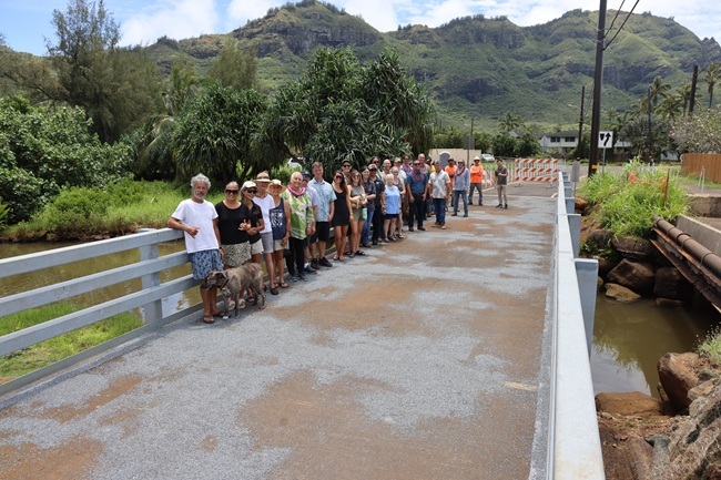 Group gathers for the reopening of the Niumalu Bridge. ###