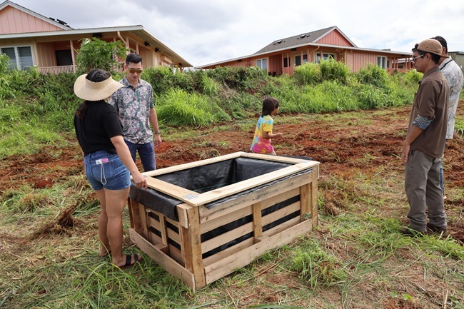 The Leadership Kaua'i team showcases a raised garden bed made from recycled pallets.
