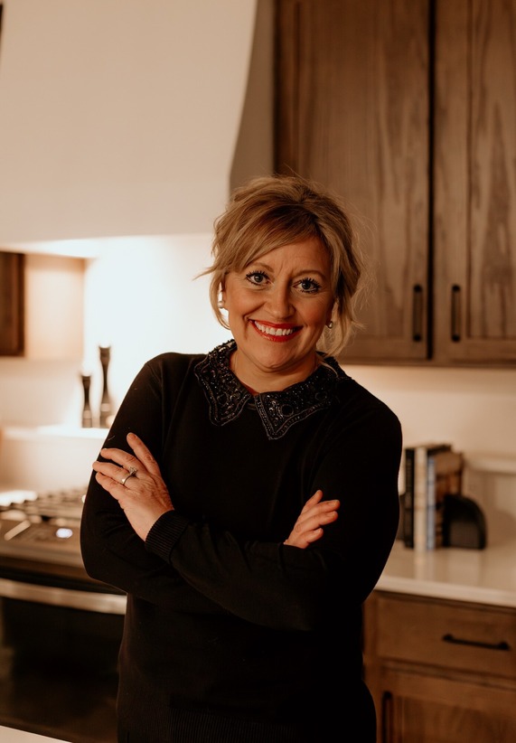 Woman in black shirt with arms crossed