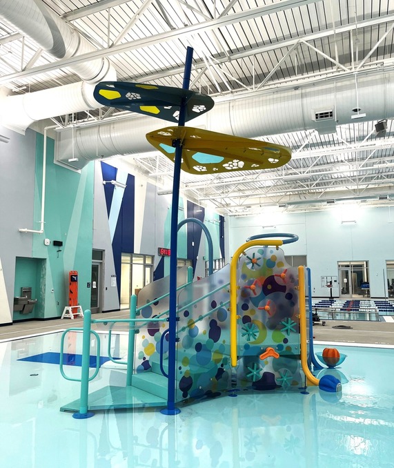 Indoor aquatic play structure with stairs 