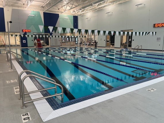 An indoor swimming pool with lanes for lap swimming.