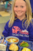 girl with school lunch tray