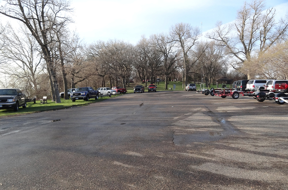 Empty boat trails fill parking area on Big Spirit Lake for walleye season opener