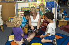 Teacher reading to preschool children