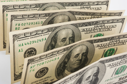 Rows of money bills in 100 dollar denominations
