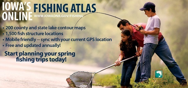 A dad helps his daughter bring in a fish with a net that his son is reeling in.