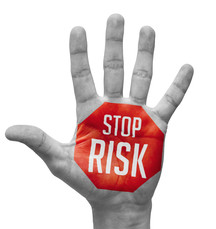 Hand with STOP RISK painted on palm