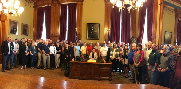 Governor Reynolds signing Proclamation