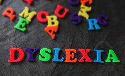 colored letters on a table that spell dyslexia