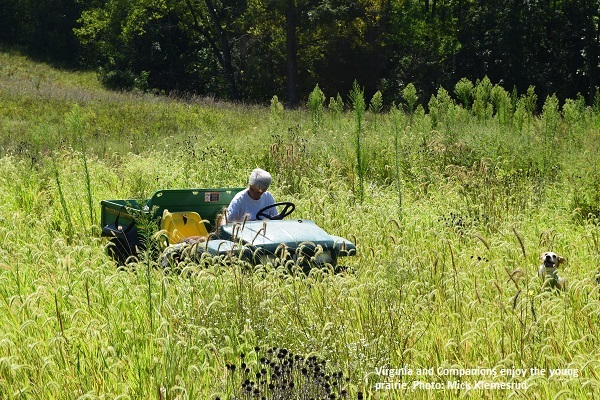 Virginia Ekstrand on an ATV in the prairie