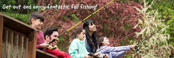 A family fishing in the fall.