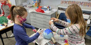 Elementary students work on a project.