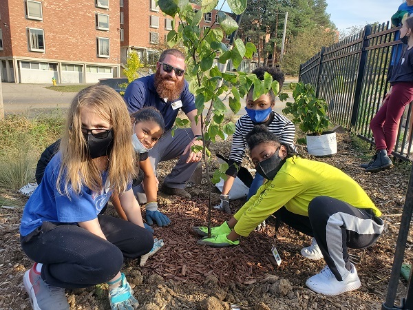 Iowa students planting trees as part of the Trees for Kids grant program.