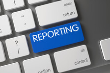 Reporting written on computer keyboard