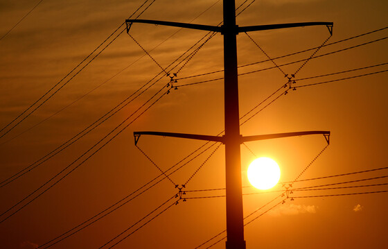 electric transmission lines at sunset